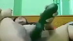 Sexy girl destroying her pussy with big fat cucumber