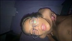 Sexy glasses babe giving blowjob to her bf