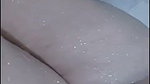 Hot lady showing her huge boobs while bathing