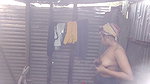 Village girl taking bath  showing her boobs