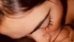 Sexy housewife giving a blowjob while being naked