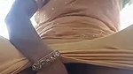 Lady fingering her pussy outdoor