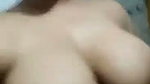 Sexy girl pressing her huge boobs