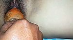 Husband inserting carrot inside her wife pussy