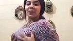 Girl with amazing boobs undressing