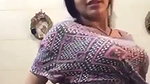 Girl with amazing boobs undressing