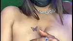 Beautiful wife pressing her boobs  milk coming out