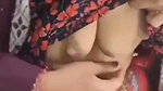 Hot housewife pressing her boobs  milk coming out