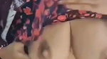 Hot housewife pressing her boobs  milk coming out