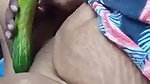 Aunty inserting cucumber inside her pussy