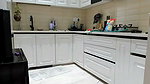 Beautiful naked girl showing her beauty in kitchen room