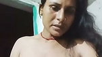 Village aunty pissing  showing her boobs