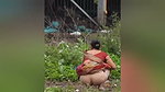 Aunty pissing in open area