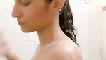 Beautiful slim girl taking bath
