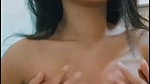 Beautiful slim girl pressing her boobs  showing
