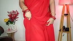 Beautiful bhabhi showing her boobs in transparent red saree