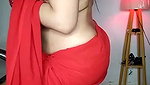 Beautiful bhabhi showing her boobs in transparent red saree