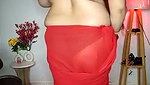 Beautiful bhabhi showing her boobs in transparent red saree