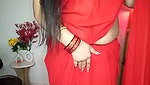 Beautiful bhabhi showing her boobs in transparent red saree