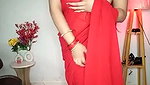 Beautiful bhabhi showing her boobs in transparent red saree