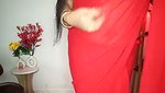 Beautiful bhabhi showing her boobs in transparent red saree