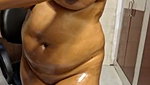 Natasha bhabhi applying oil  showing her shining hot figure