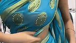 Beautiful girl show her boobs in blue saree