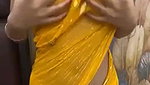 Slim beautiful girl in yellow saree  show her boob