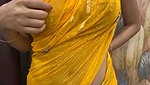Slim beautiful girl in yellow saree  show her boob
