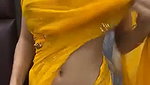 Slim beautiful girl in yellow saree  show her boob
