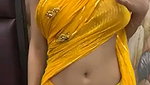 Slim beautiful girl in yellow saree  show her boob