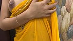 Slim beautiful girl in yellow saree  show her boob