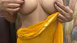 Slim beautiful girl in yellow saree  show her boob