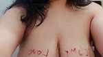 Desi Chubby babe writing with lipstick on titties