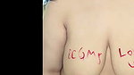 Desi Chubby babe writing with lipstick on titties