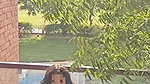 Beautiful girl fingering her pussy on balcony