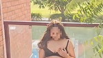 Beautiful girl fingering her pussy on balcony