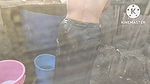 Anita Yadav bathing outside