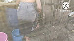 Anita Yadav bathing outside