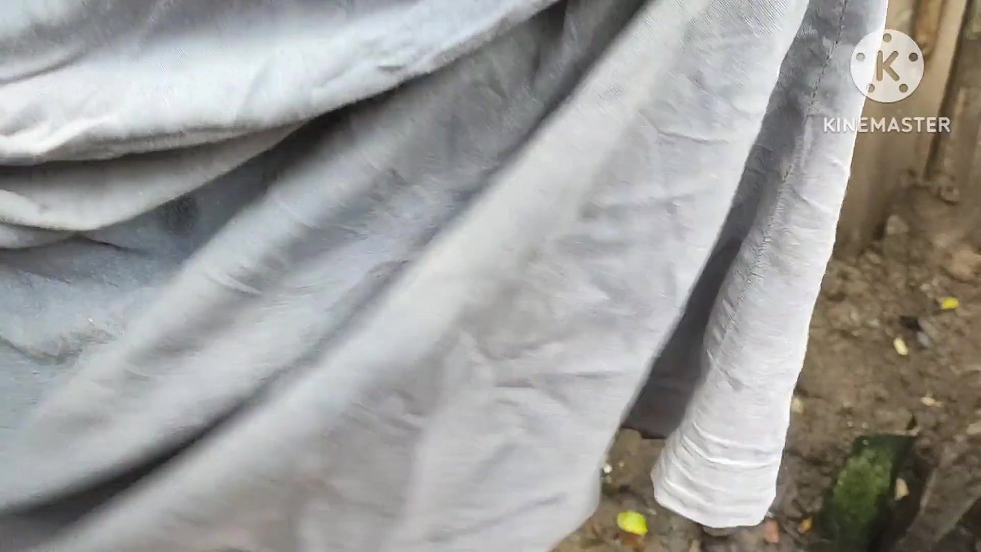 Indian house wife bathing outside