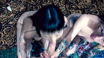 Punk dude with lots of tattoos is having a threesome with two skinny teens