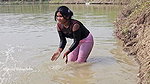 Bengali girl net fishing in Village pond