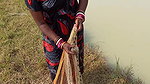Amazing Lady fishing in village with bare hand and