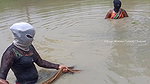Amazing Masked Village Women fishing in the Rain