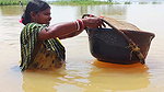 Indian Woman Goes Fishing in Flood