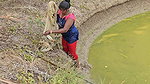 Mouni Fishing in Village pond floating on a Thermo