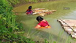Traditional net fishing by village women   Village