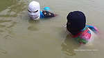 Village Masked Women Fishing in Dangerous Water
