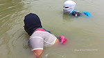 Village Masked Women Fishing in Dangerous Water