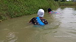 Village Masked Women Fishing in Dangerous Water